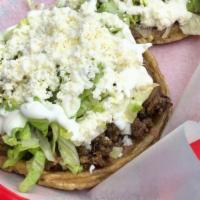 Sopes with Meat · choice of meat, beans, lettuce, cheese, sour cream.