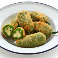 Jalapeno Poppers (6 pieces) · Breaded jalapeno stuffed with creamy cheese.