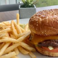 Waterfront Burger · Certified angus beef patty, pain de mie bun, caramelized red onion, tomato lettuce, and choi...