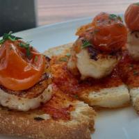 Toasts & Handhelds Garlic Shrimp Toast · Roasted tomato, lemon, and chili oil.