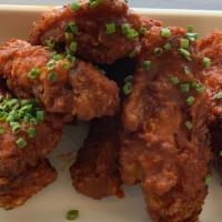 Spanish Style Chicken Wings · With spicy paprika sauce.
