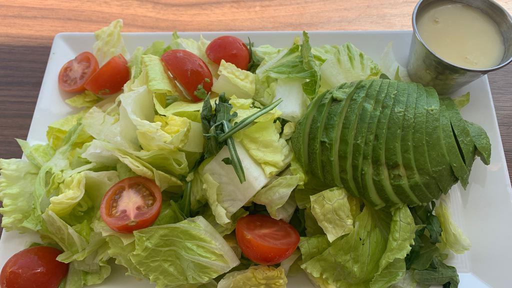 Simple Greens · Avocado, grape tomato, and lemon vinaigrette.