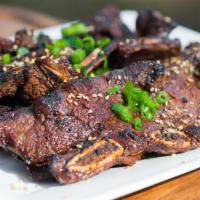 Galbi (BBQ Short Ribs) · Grilled beef ribs marinated with house special sauce