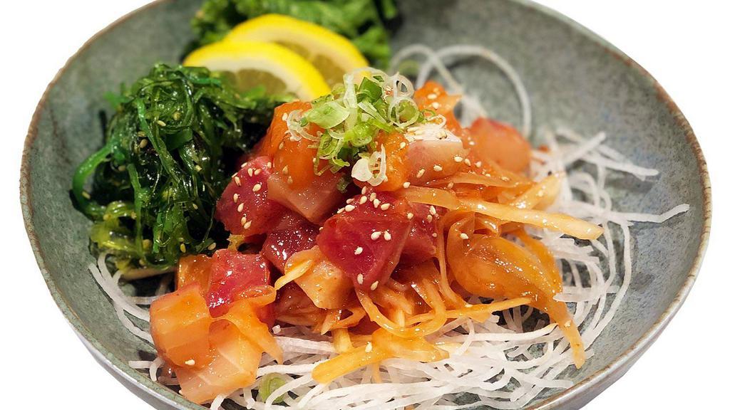 Poke Salad · Assorted sashimi with roasted almond, seaweed and special poke sauce.