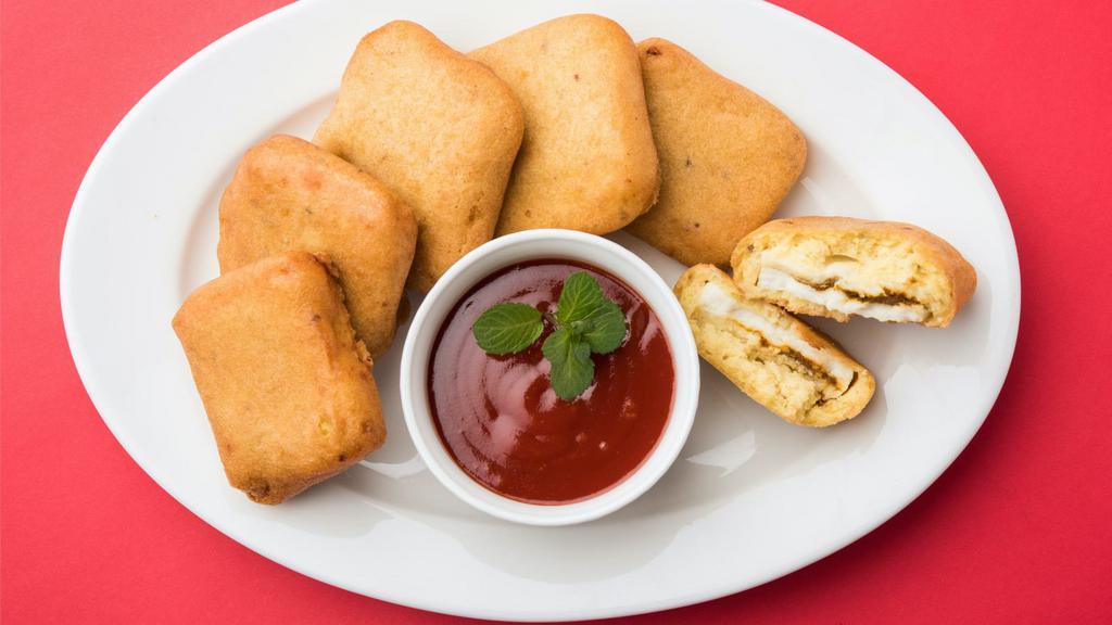 Paneer Pakoras · Fresh cottage cheese dipped in chickpea batter. Served with chutney.