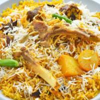 Goat Biryani · An exotic blend of basmati rice, savory goat meat and traditional spices and herbs.