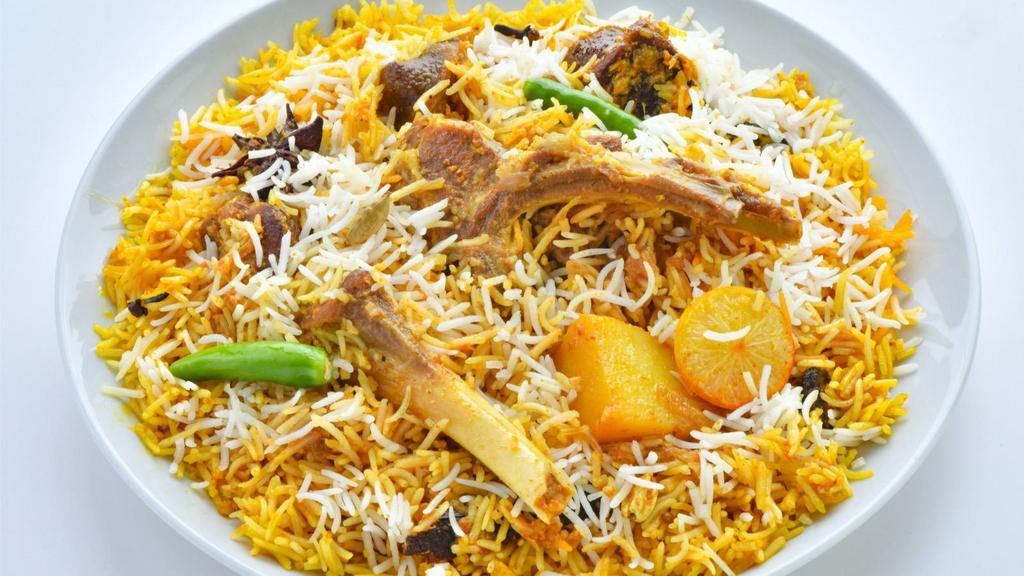 Goat Biryani · An exotic blend of basmati rice, savory goat meat and traditional spices and herbs.
