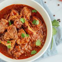 Lamb Vindaloo · Marinated lamb in a spiced curry sauce with potatoes.