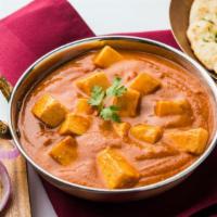 Paneer Tikka Masala · Creamy tomato and masala base covered with Indian cheese, tomatoes, onions and fenugreek.