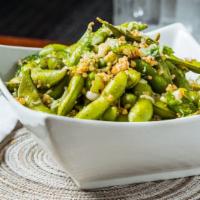 Loco Edamame · Edamame sautéed with Mexican chili and spices. Topped with Parmesan cheese.