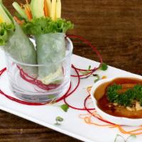 Avocado Mango Spring Roll · Fresh avocado, mango, iceberg lettuce, mint, carrots and cucumber, wrapped with rice paper w...