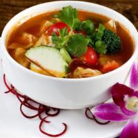 Tom Yum · Medium. Hot and sour soup with tomatoes, lemongrass, kaffir lime leaves, galangal and mushro...