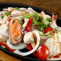 Sizzling Seafood · Prawn, scallop, calamari, mussel with spicy Thai style chill sauce with onion, bell pepper, ...