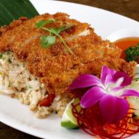 Crispy Chicken Fried Rice · Served over egg fried rice, tomatoes, white and green onions, with sweet and sour dipping sa...