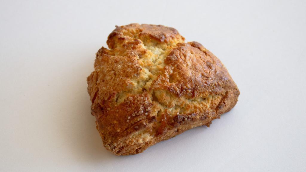 Ginger Scone · Our scones are uniquely crisp and buttery with crumbly corners and a soft, flaky interior, studded with caramelized ginger.