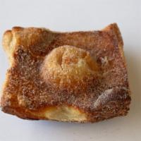 Cinnamon Puff · A petite flaky pastry made with our croissant dough, dusted in cinnamon sugar.