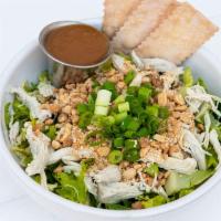 Asian Chicken Salad · Sliced romaine, Savoy cabbage with mint, cilantro, scallions, roast chicken, sesame seeds, g...