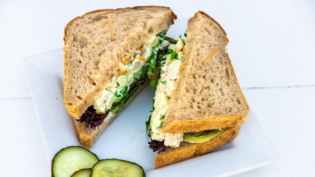 Chicken Salad Sandwich · Organic chicken, apples, toasted almonds & scallions with our house-made mayonnaise, on your choice of bread, with housemade mayonnaise, organic baby lettuce, with house-made pickles on the side unless otherwise noted.