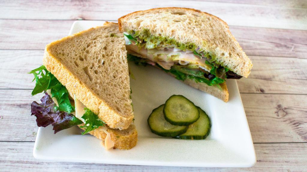 Turkey Pesto Sandwich · Diestel oven roasted turkey with pesto. Pesto contains pine nuts and basil. Includes your choice of bread with mayonnaise and organic lettuces with house-made pickles on the side unless otherwise noted.