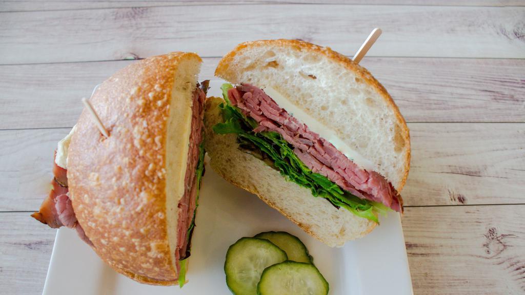 Roast Beef Sandwich · Rare roast beef with Cambozola blue cheese and organic baby lettuces on your choice of bread, served with house-made pickles.