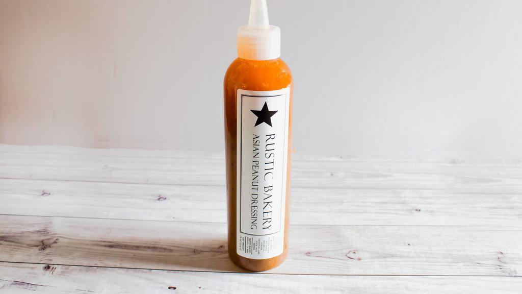 Asian Chicken Salad Dressing, 16 fl. oz. bottle · Take home the dressing we serve with our Asian Chiken Salad! Combines peanuts with a bit of spice from  fresh ginger and chipotle and tang from fresh lime that's sure to satisfy.