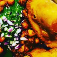 Samosa Chole (2 Pieces) · Vegan. Vegetables samosa, made with all purpose flour, filled with potato, peas deep fry ser...
