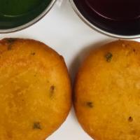 Aloo Tikki · Vegan. Mashed potato pate, deep fry all Indian spices, served with mint sauces and tamarind ...