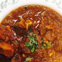Goat Masala (No Rice) · 16 oz bowl cooked Goat bone in or bone less meat ,onion ginger, garlic and own spices, tomat...