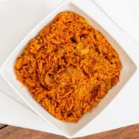 Chicken Biryani · It Indian basmati rice cooked with onion garlic ginger, and boneless chicken.