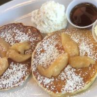 Caramelized Apple Pancakes · 2 large caramelized granny smith apple buttermilk pancakes served with syrup and butter.