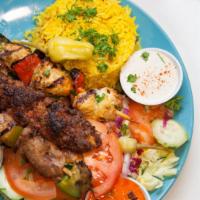 Mixed Grill Plate · Mixed grill consists of chicken and lamb shish kebab, kofte kebab, served with rice, green s...