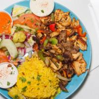 Combo Shawarma Plate · Chicken and beef, served with rice, hummus, green salad, and pocket bread.