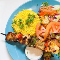 Chicken Shish Kebab Plate · Chicken, served with rice, hummus, green salad, and pocket bread.
