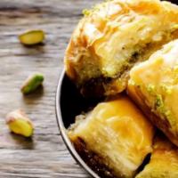 Baklavas (2 pcs) · Layered filo dough with pistachio in light syrup.