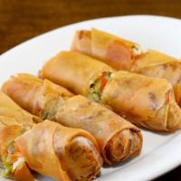 Spring Rolls · Fresh shredded cabbage, celery, carrots, and onions in a thin crépe deep fried to golden bro...