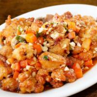 Spicy Dried Fried Chicken · Deep fried chicken chunks tossed with carrots, mushrooms, chili oil, minced ginger, ginger a...