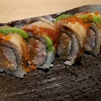Dragon Roll · Out: unagi, avocado, masago, & unagi sauce. In: crab* & shrimp tempura.