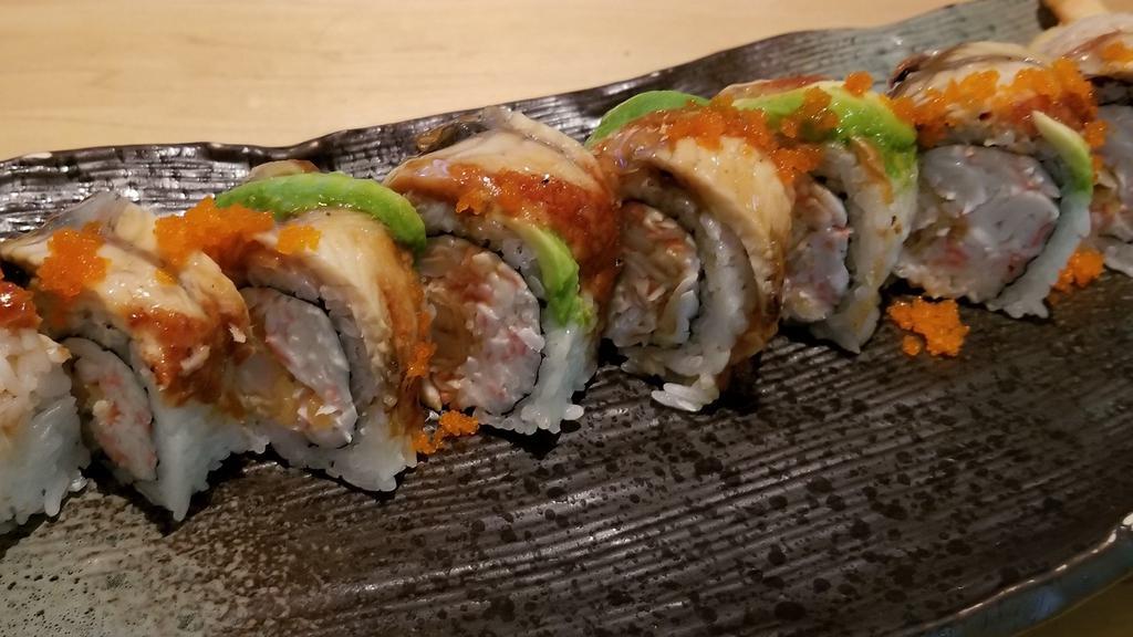 Dragon Roll · Out: unagi, avocado, masago, & unagi sauce. In: crab* & shrimp tempura.