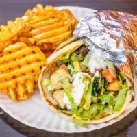 Chicken Wrap · Grilled chicken diced and served with veggie mix, romaine lettuce, tzatziki and chutney sauc...