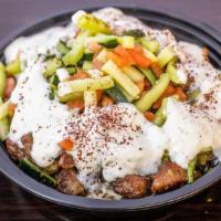 Lamb Bowl · Grilled lamb gyro served over seasoned basmati rice, topped with our veggie mix, tzatziki an...