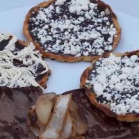 Memelitas (Each) · Handmade thick tortilla, topped black beans paste, fresh cheese, or quesillo, grilled onions...