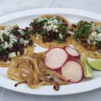 Street Taco (Each) · Small yellow packaged tortilla with your choice of meat topped with cilantro, onion, limes a...