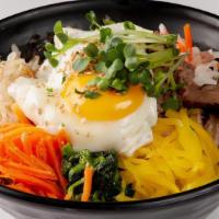 33. Bibim Bab · Vegetables, seaweed, and egg over rice with house-made spicy sauce.