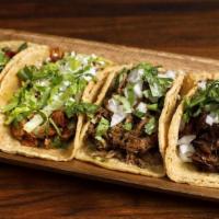 4 Tacos · Choose from our taco selections including meaty and veggie options. Comes with three signatu...