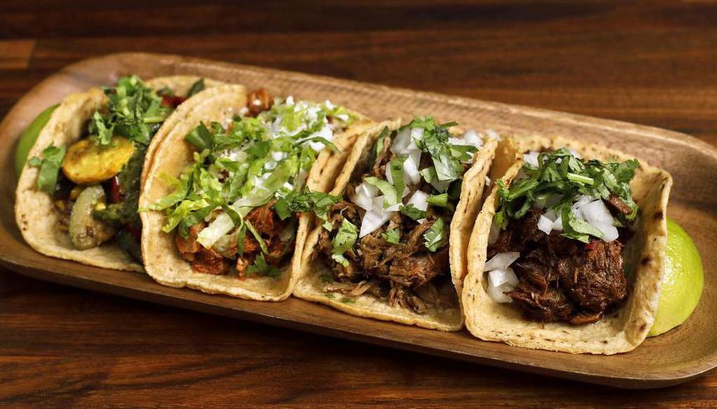 4 Tacos · Choose from our taco selections including meaty and veggie options. Comes with three signature salsas.