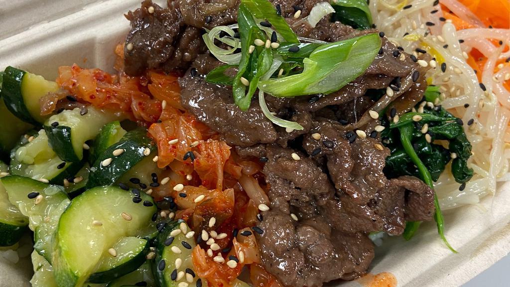 Bibimbap · Sautéed vegetables, bulgogi beef, served with white rice and our Homemade Korean chili sauce.