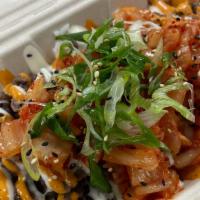 Fire Rice Bowl · Bulgogi beef, kimchi, shredded cheese, homemade garlic aioli, homemade Korean chili sauce, s...