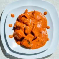 Butter Chicken · Butter infused tomato sauce chicken, finished with fenugreek cream.