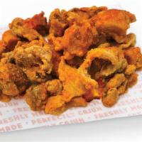 Chicken Cracklins · The ultimate on-the-go snack food. Morsels of juicy chicken with skin are bathed in Krispy K...