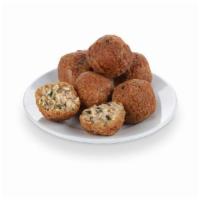 Boudin Bites · Rice, pork, & a blend of Cajun seasonings, rolled & battered to perfection!